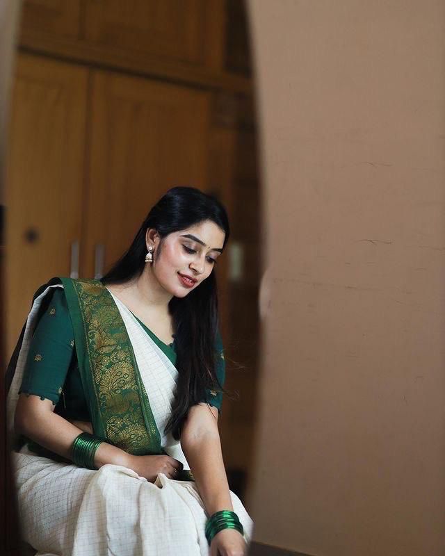 Off White Saree with Green Traditional Border