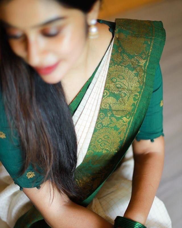 Off White Saree with Green Traditional Border