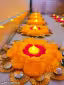 5 pic Beautiful pom pom rangoli tealight cendal holding